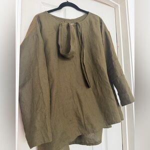 New never worn before not perfect linen leaf top